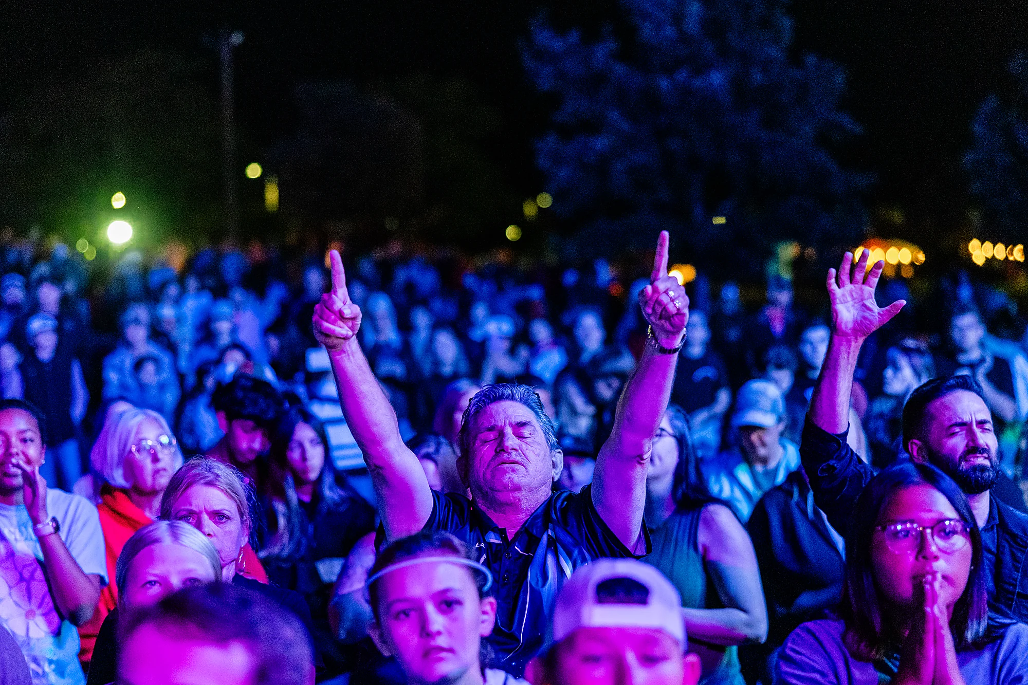 The crowd worships with hands raised at Horizon Music Festival