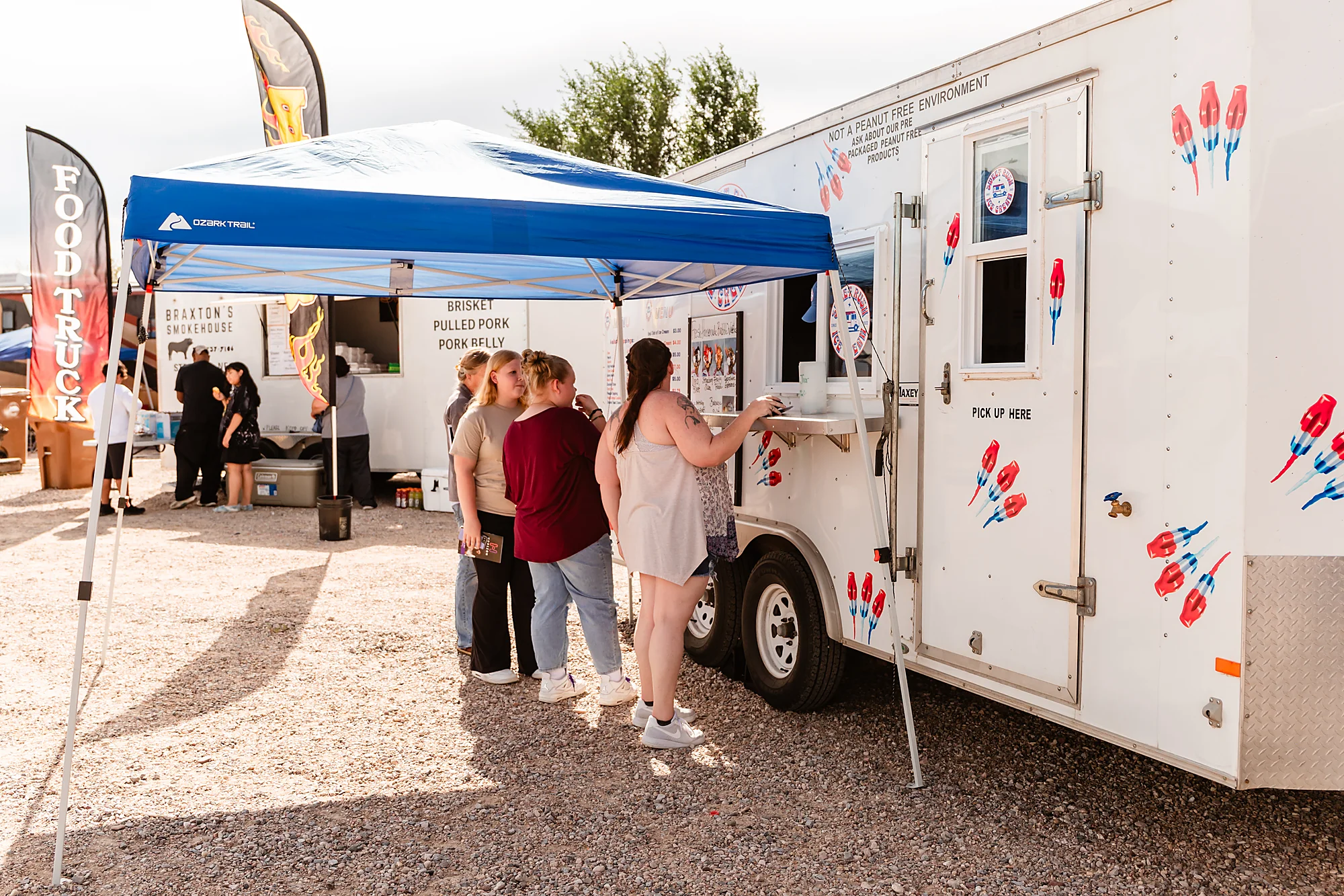 Festivalgoers order from a food truck at Horizon Music Festival