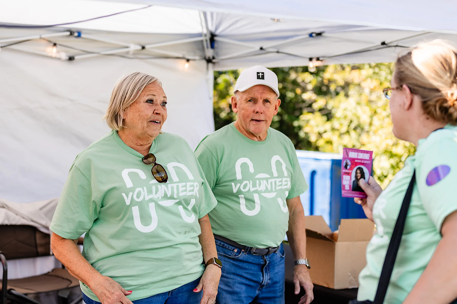 Volunteers in green serving at Horizon Music Festival
